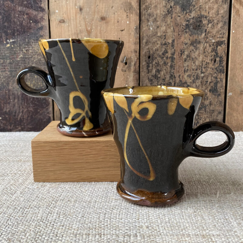 These mugs are all very similar in design, unfortunately there is no way of selecting which design you may receive. As a hand-thrown, unique item there may be some slight variation in exact dimensions.