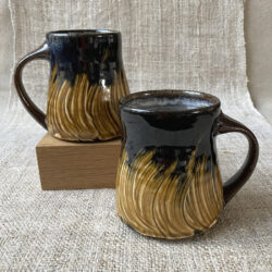 These mugs are all very similar in design, unfortunately there is no way of selecting which design you may receive. As a hand-thrown, unique item there may be some slight variation in exact dimensions.
