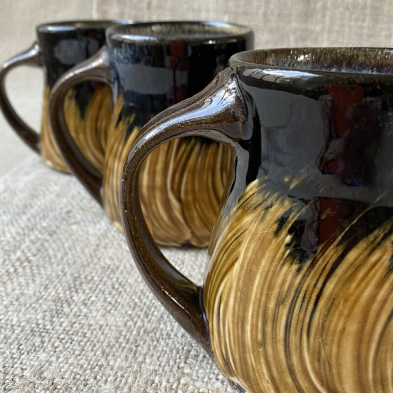 These mugs are all very similar in design, unfortunately there is no way of selecting which design you may receive. As a hand-thrown, unique item there may be some slight variation in exact dimensions.