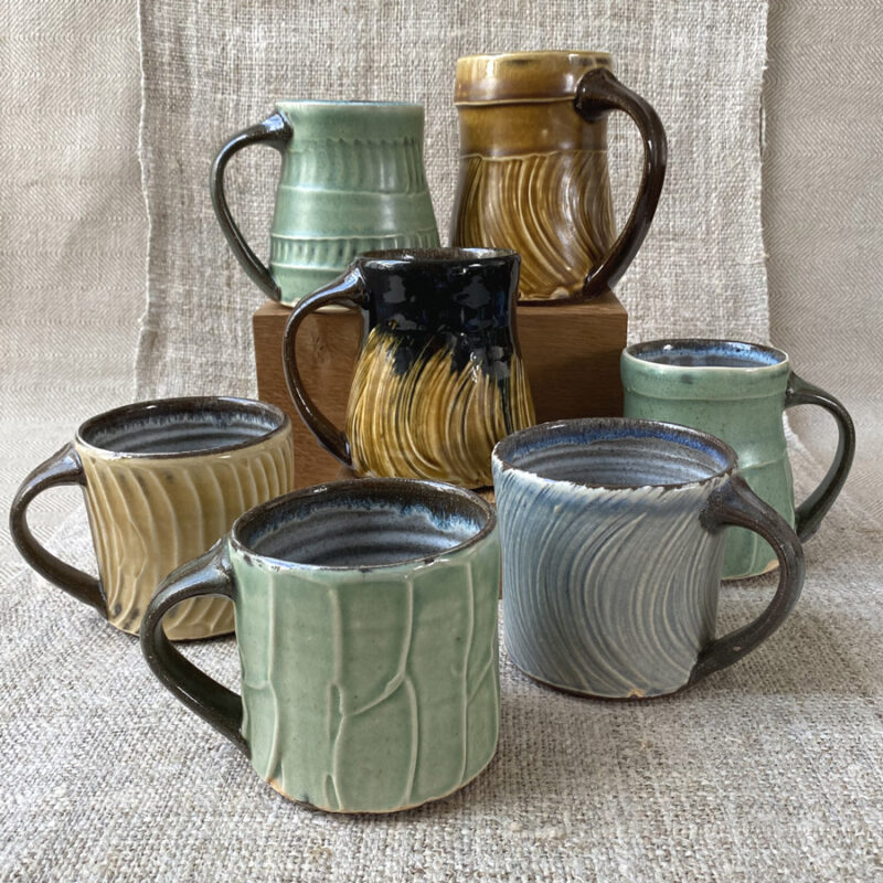 These mugs are all very similar in design, unfortunately there is no way of selecting which design you may receive. As a hand-thrown, unique item there may be some slight variation in exact dimensions.